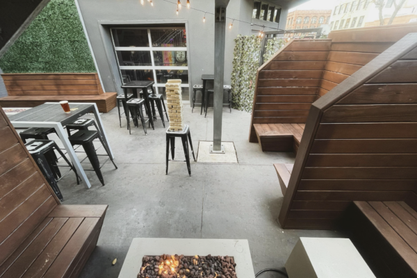 A serene patio scene showcasing a fire pit with benches arranged for social gatherings A serene patio scene showcasing a fire pit with benches arranged for social gatherings