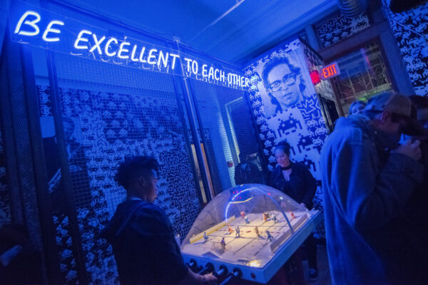 A room featuring a neon sign that reads "excellent to each other," creating a vibrant and positive atmosphere. A room featuring a neon sign that reads "excellent to each other," creating a vibrant and positive atmosphere.